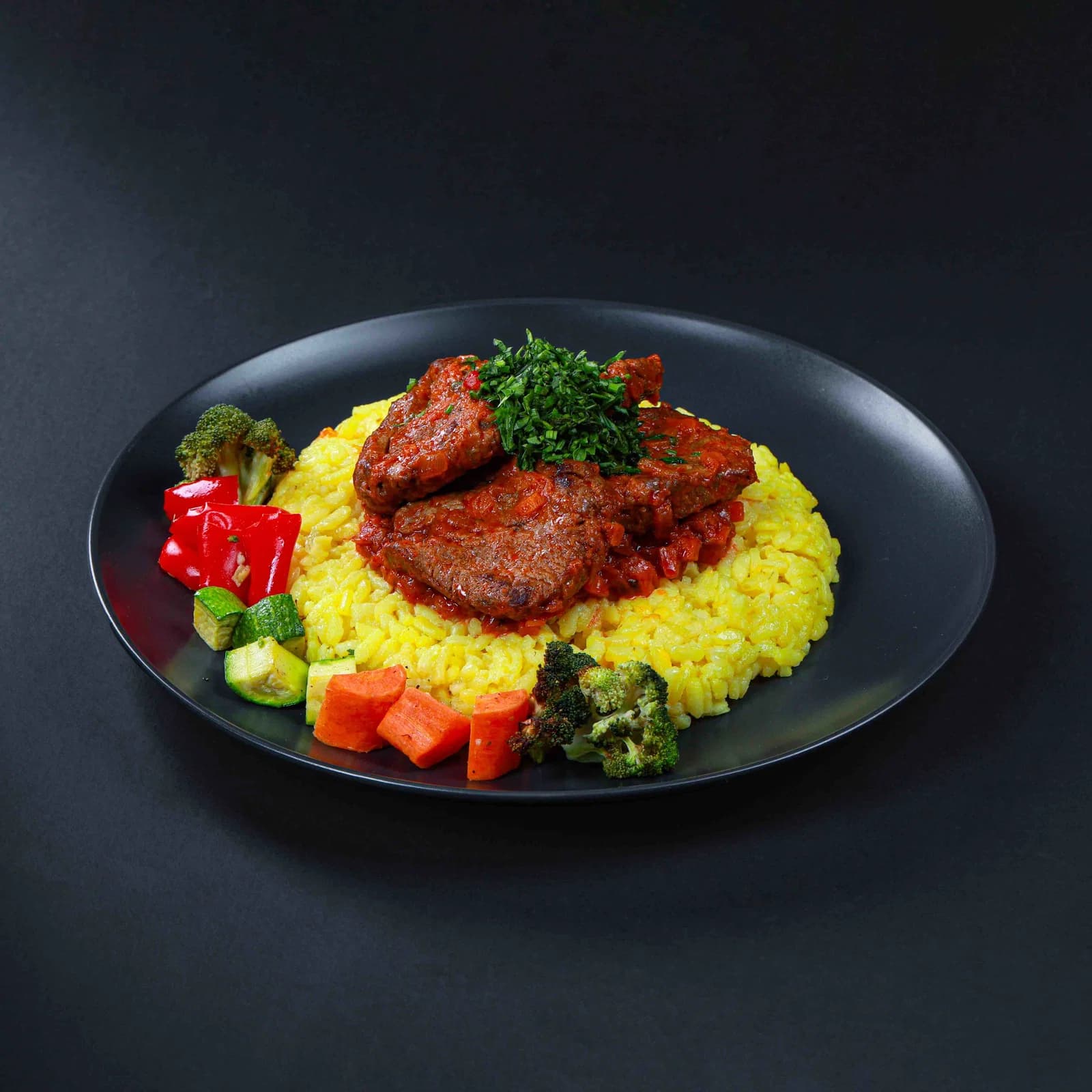 Veal Osso Buco with Saffron Risotto and Gremolata-Roasted Vegetables